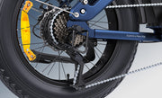 Close-up of a bicycle wheel with chain and gear system on a white background